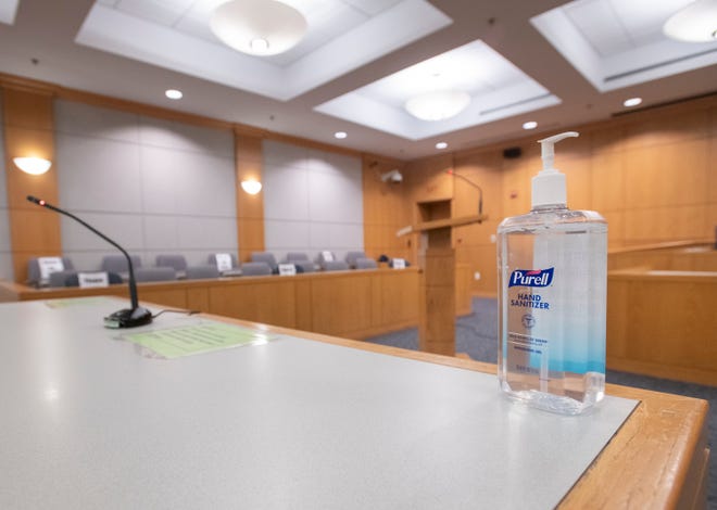 Hand sanitizer bottles are among the COVID-19 precautions in place at the Escambia County Courthouse in downtown Pensacola on Friday, Sept. 11, 2020.  The courthouse that has had limited access due to the COVID-19 pandemic is preparing to resume jury trials soon.