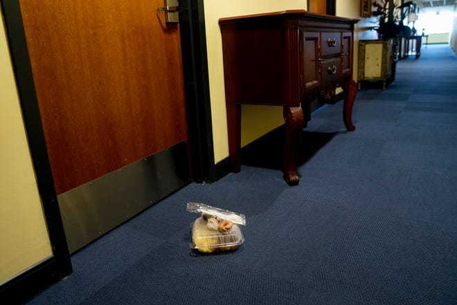 A meal for a student in quarantine sits in the hallway in Saint Francis Xavier Hall at Ave Maria University on Thursday, September 17, 2020. Rooms in the section of Xavier Hall that is typically used as a guesthouse are currently being used as isolation rooms for students who have to quarantine.