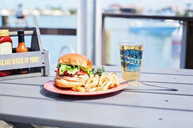 On Snook Inn ' s many open-air patios, customers can order grouper in platters, baskets and sandwiches.