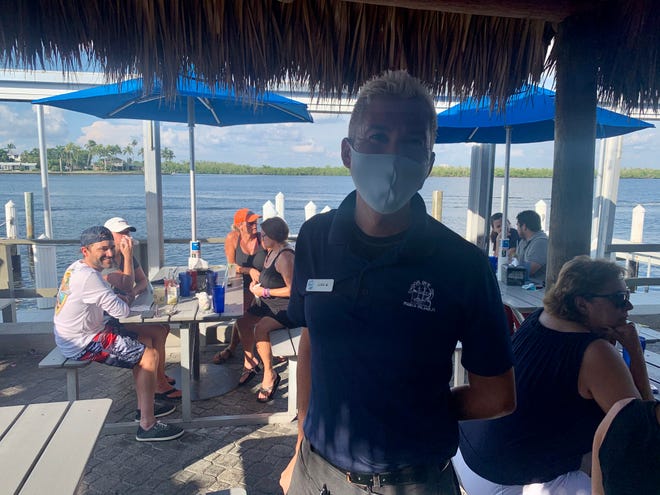 Staff wear masks at Snook Inn on Marco Island