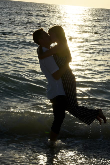 Brent and Elana take their romance out into the surf. The couple came from Chicago to Marco Island, with longstanding family associations, for a surprise proposal on the beach at sunset.
