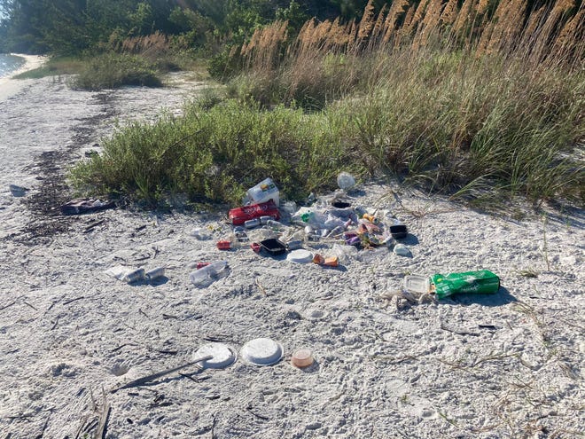 Colleen M. Gill, a tour guide with Florida Adventures and Rentals, spent two hours picking up over 100 pounds of trash left on Dickmans Point, Kice Island on Oct. 14, 2020.