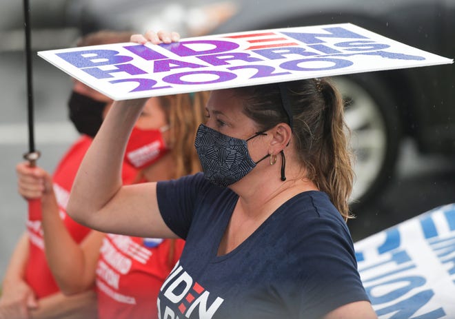 Supporters attend a drive-in rally for vice-presidential candidate Kamala Harris Monday, October 19, 2020 at the University of North Florida in Jacksonville, Florida.