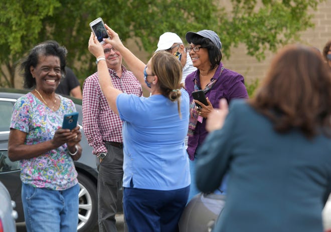 Vice-presidential candidate Kamala Harris talks with voters at the Highlands Branch of the Jacksonville Public Library Monday, October 19, 2020 on the first day of early voting in Jacksonville, Florida.