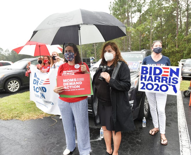 Supporters attend a drive-in rally for vice-presidential candidate Kamala Harris Monday, October 19, 2020 at the University of North Florida in Jacksonville, Florida.