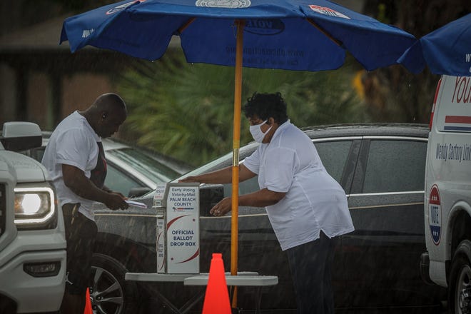 Monday morning rains fell on the early voting site at Wells Recreation Community Center in Riviera Beach, Fla., on Monday, October 19, 2020.