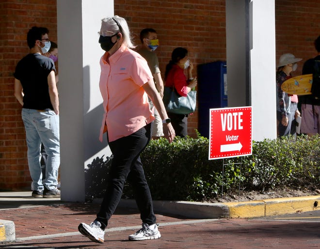 Residents wait in line to early vote in the 2020 Presidential Election at the Millhopper Branch of the Alachua County Library, in Gainesville Fla., Oct. 19, 2020. Alachua County has six early voting locations that are open daily 9am to 6pm.
