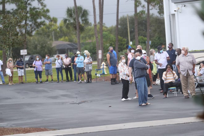 The East County Regional Library and Veterans Park in Lehigh Acres had long lines of early voters on Monday, October 19, 2020. Voters at the library braved a steady down pour.