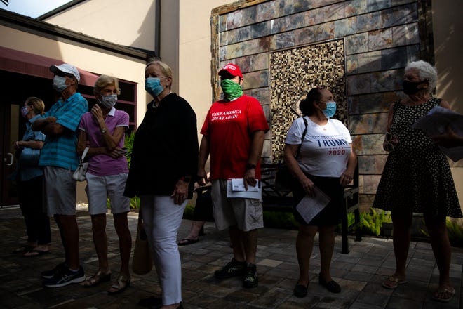 Naples residents wait to enter the polling site at the Norris Center during the first day of early voting, Monday, Oct. 19, 2020.