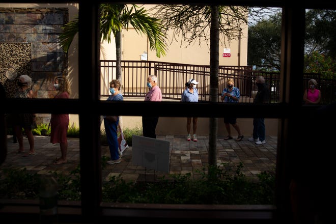 Community members wait to cast their votes, Monday, Oct. 19, 2020, at the Norris Center in Naples.
