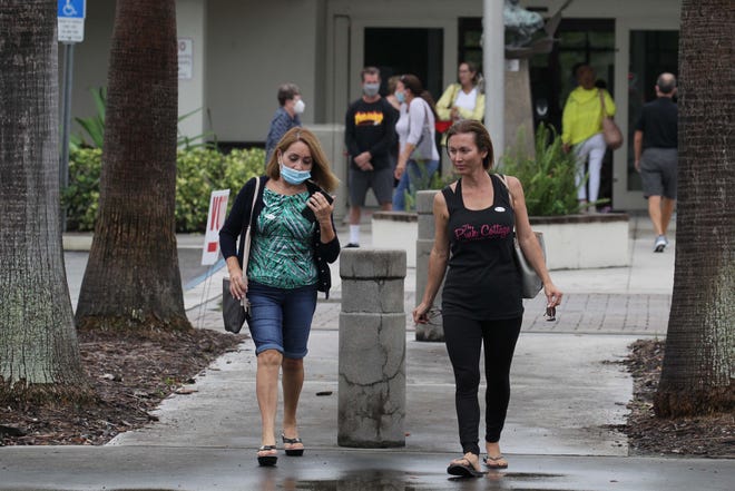 Marta Guevara (left) and Sandra Otero, both of Stuart, leave the Hoke Library in Jensen Beach Monday, Oct. 19, 2020, after casting their ballot on the first day of early voting. "It's a right that I don't have in my previous country," said Otero, a former Cuban, now an American citizen. "I want to do it as fast and early as possible, I don't want to wait til the last minute."