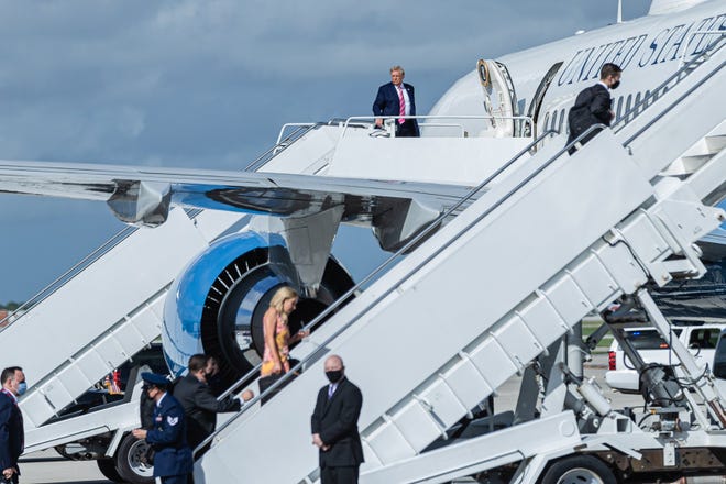 President Donald J. Trump boards Air Force One at Palm Beach International Airport in West Palm Beach, Saturday, October 24, 2020. The president cast an early ballot for the 2020 presidential election at the main branch of the Palm Beach County library on Summit Blvd. in West Palm Beach.