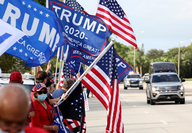 Voters await the arrival of President Trump, outside of the early voting polling station located at The Palm Beach County Library, 3650 Summit Blvd. West Palm Beach.