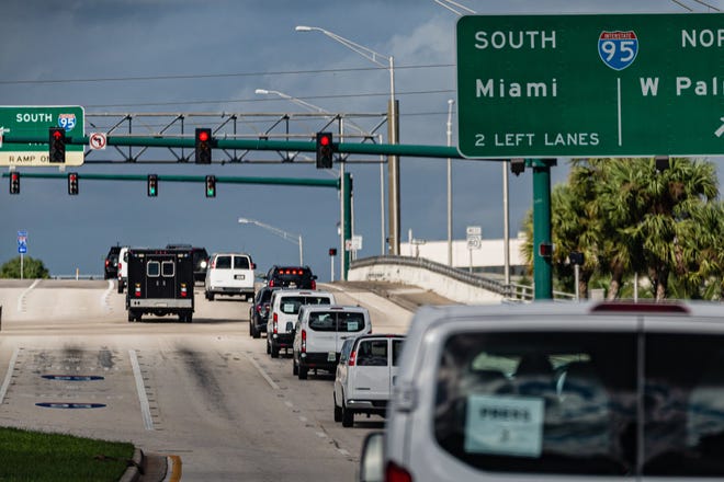 The Presidential motorcade travels west along Southern Blvd. as it heads to the main branch of the Palm Beach County library on Summit Blvd. in West Palm Beach, Saturday, October 24, 2020. President Donald J. Trump cast his ballot for the 2020 presidential election at the library this morning.