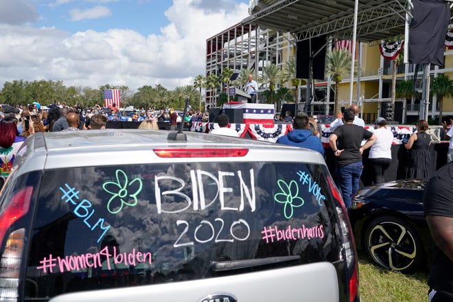 Former President Barack Obama speaks at a drive-in rally while campaigning for Democratic presidential candidate former Vice President Joe Biden Tuesday, Oct. 27, 2020, in Orlando, Fla.