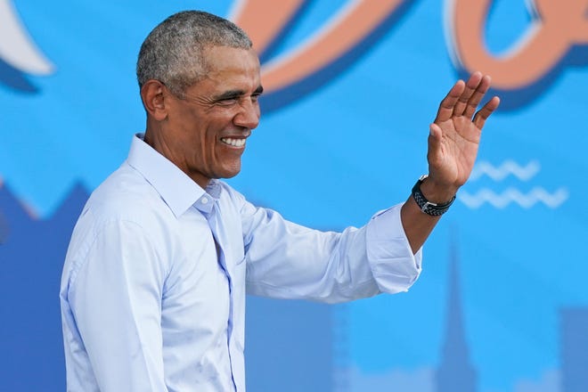 Former President Barack Obama waves to supporters as he leaves a rally while campaigning for Democratic presidential candidate former Vice President Joe Biden Tuesday, Oct. 27, 2020, in Orlando, Fla.