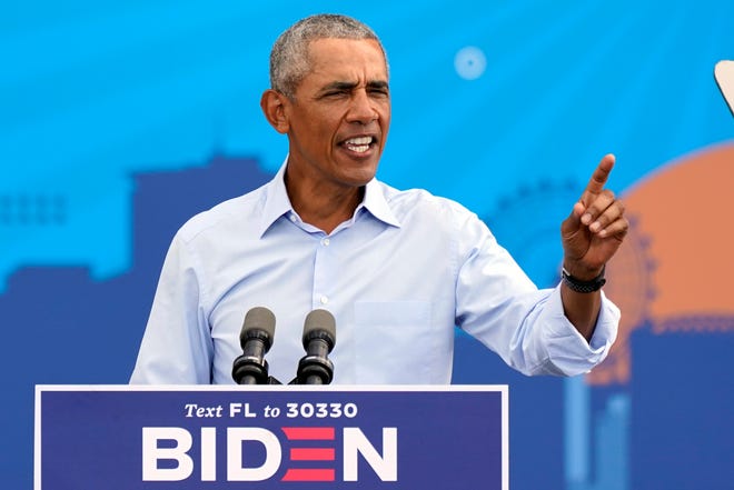 Former President Barack Obama speaks at a rally as he campaigns for Democratic presidential candidate former Vice President Joe Biden Tuesday, Oct. 27, 2020, in Orlando, Fla.