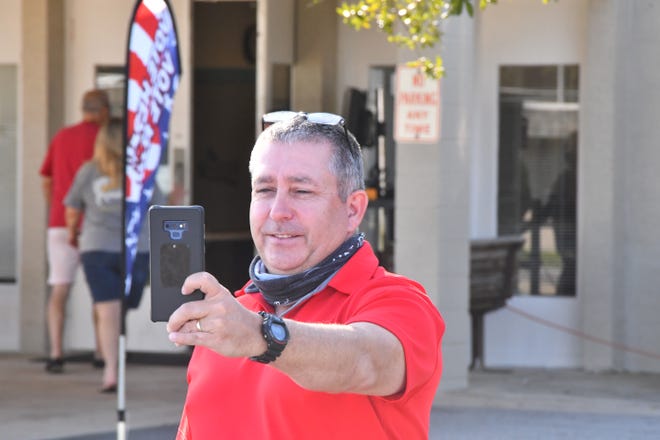 Shannon Bryson of M.I. does a selfie after voting for the first time. With Saturday being the last day for early voting, early voting sites in Brevard County were busy throughout the day on Friday.