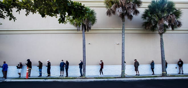 Voters wait in line at precinct 86 at the Lee County Elections Center in Fort Myers on Tuesday, November 3 morning.