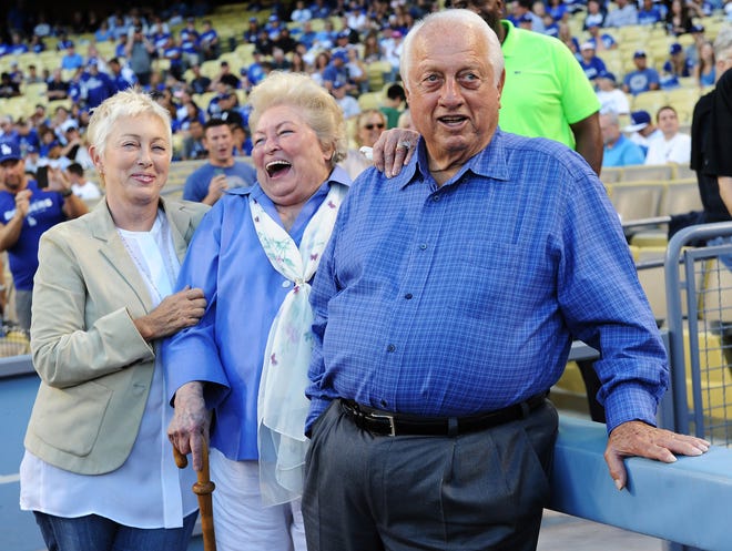 Tommy Lasorda and his wife Jo and daughter Laura, watch a tribute on the video board in honor of his 86th birthday.