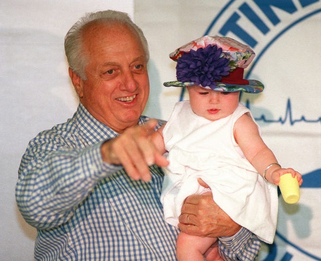 Tommy Lasorda with his granddaughter, Emily Goldberg, in 1996.