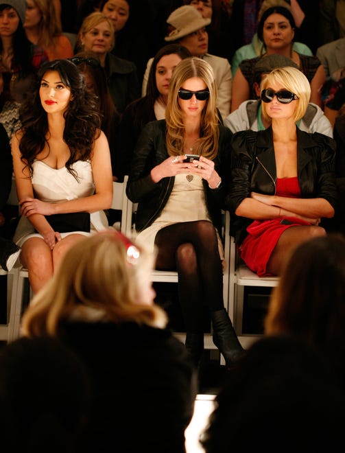 Paris Hilton (right) sat with pal Kim Kardashian (left) and sister Nicky Hilton (center) at a 2009 Tracy Reese fashion show.