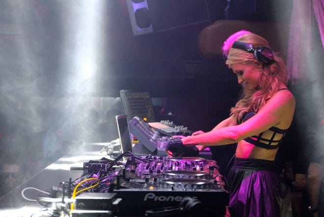 Hilton is shown DJing in Ibiza during a 2013 residency.