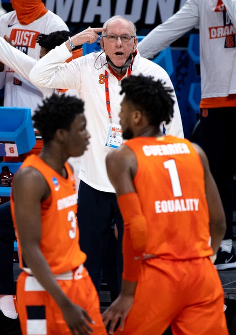 Second round: Syracuse Orange head coach Jim Boeheim signals to forward Quincy Guerrier and forward Kadary Richmond during the second round game against the West Virginia Mountaineers at Bankers Life Fieldhouse in Indianapolis, Ind.