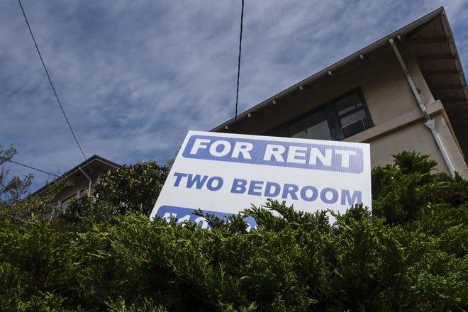 A sign is displayed advertising a two-bedroom apartment.