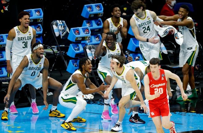 Final Four: The Baylor bench celebrates after guard Mark Paterson scored during the second half of the Bears' win over Houston.