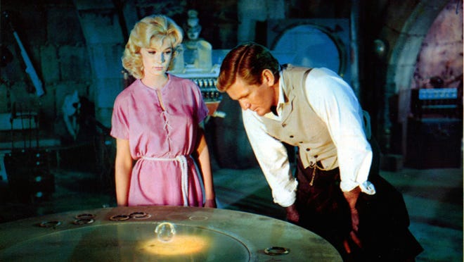 15. " The Time Machine " (1960) • Director: George Pal • Cast: Rod Taylor, Alan Young, Yvette Mimieux • Domestic box office: N/A The 1960 ’ s version of “ The Time Machine ” follows a scientist who travels into different time periods of the future to observe various outcomes, including a post-apocalyptic world. The movie was better received than the 2002 version, directed by Simon Wells, with 76% of critics and 79% of audiences giving it a positive rating. The movie won an Oscar for special effects.