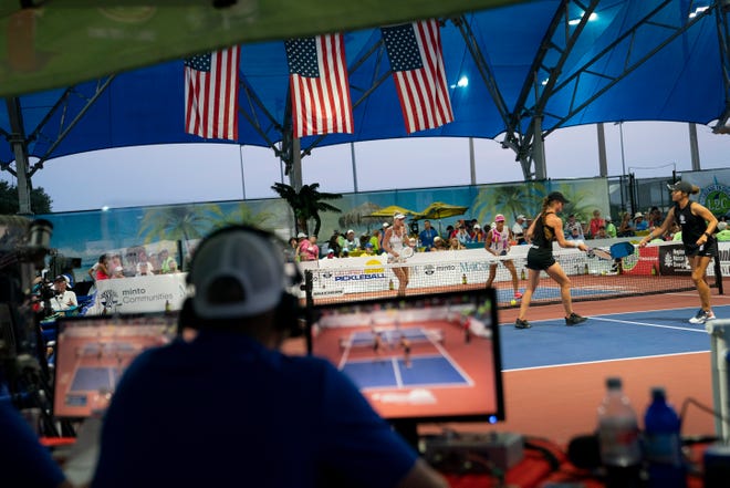 Commentators for the CBS Sports Network watch the women's pro doubles final during the U.S. Open Pickleball Championships at East Naples Community Park on Saturday, April 24, 2021.