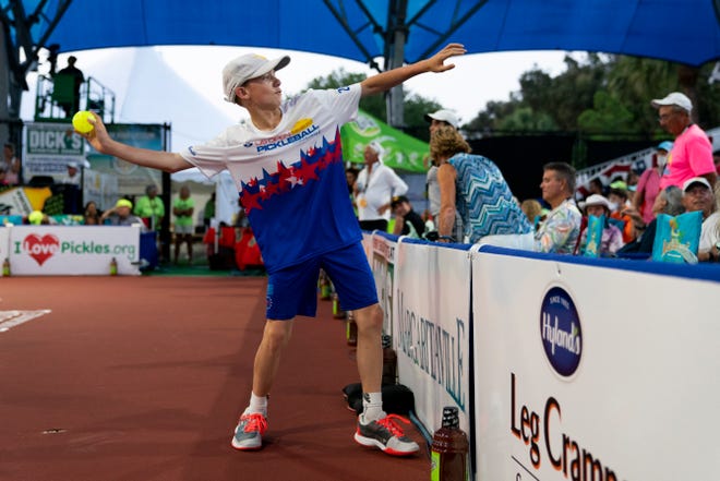 London Emmett Gray, 12, throws a pickleball to the crowd during the U.S. Open Pickleball Championships pro doubles final at East Naples Community Park on Saturday, April 24, 2021.