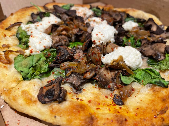 A spinach and mushroom pizza from True Food Kitchen, North Naples.