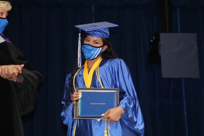 Kimberly Lopez-Valle gets her diploma at Everglades City School graduation on Friday, May 28, 2020, in Everglades City.