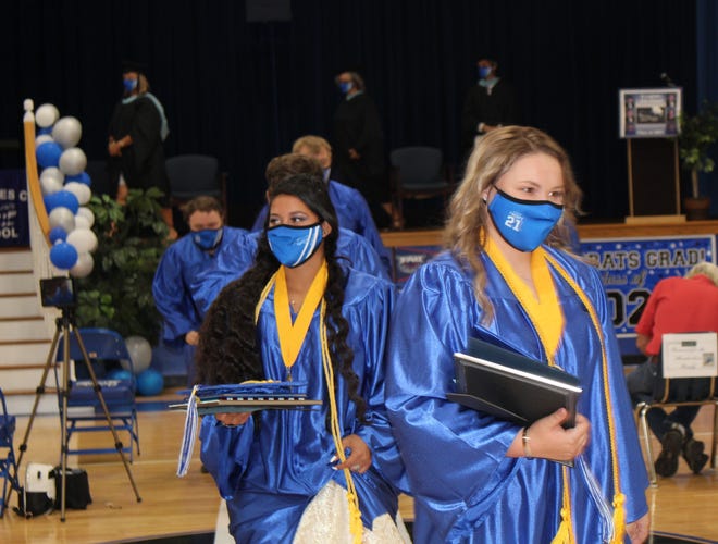 Everglades City School seniors Kimberly Lopez-Valle and Lexie Hendrickson march out after their graduation on Friday, May 28, 2020, in Everglades City.