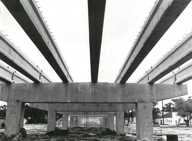 May 1966: Concrete piers which will support the Hart Bridge reach toward the sky in the Fairfield area as work progresses on the $8.5 million structure. In this photo, pre-stressed concrete and steel beams have been dropped in place in the Gator Bowl area.