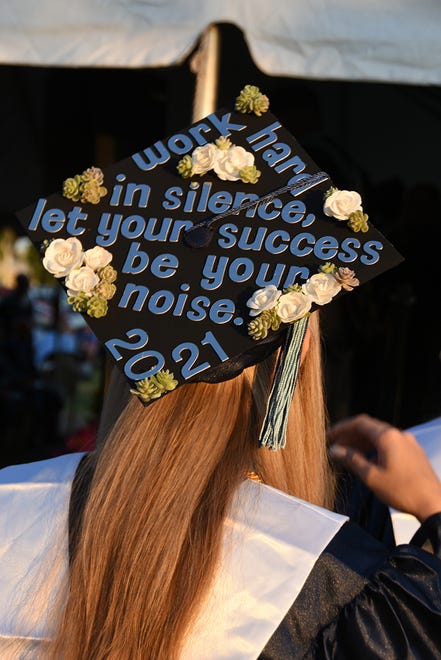 Some students put a message on their mortarboards. Marco Island Academy graduated its senior class Friday evening in a commencement ceremony at Veterans' Community Park.