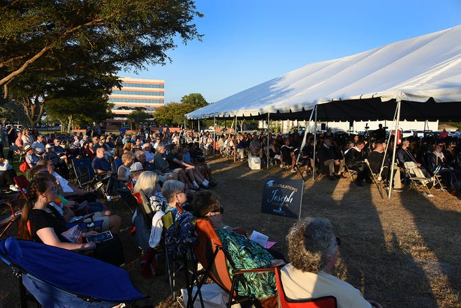 Hunreds gathered inside and outside the tent on a beautiful evening. Marco Island Academy graduated its senior class Friday in a commencement ceremony at Veterans' Community Park.
