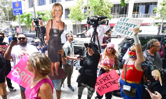 Fans and supporters gather to support Britney Spears with a life-size cardboard cutout of the singer.