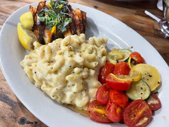 Blackened grouper with veggies and smoked gouda macaroni from Ben Allen's Backyard Grill & Pub, South Naples.