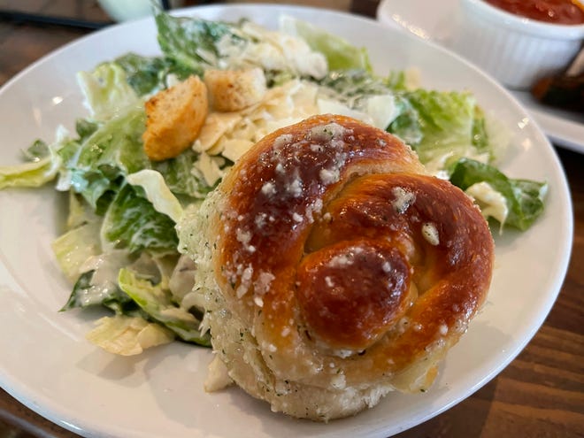 A side Cesar salad with one of Joey's famous garlic knots from Joey's Pizza & Pasta, Marco Island.