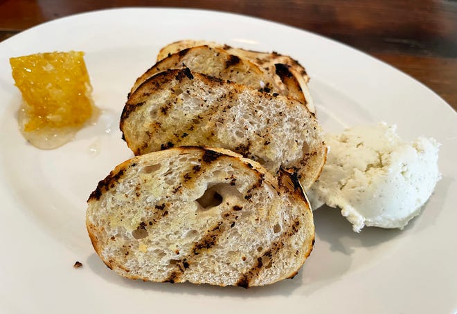 Grilled bread featuring ricotta cheese and honeycomb from Joey's Pizza & Pasta, Marco Island.