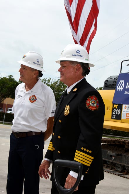Former Fire Chief Mike Murphy, left, with current Fire Rescue Chief Chris Byrne after the groundbreaking. The city broke ground on their new fire station Tuesday morning, inside the old station which will be razed to make room for it.
