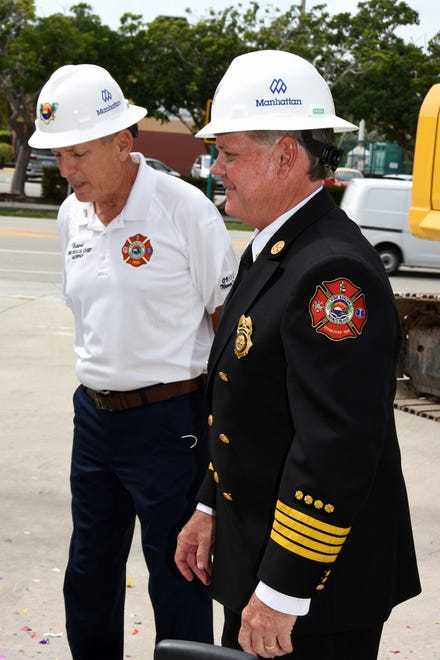 Former Fire Chief Mike Murphy, left, with current Fire Rescue Chief Chris Byrne after the groundbreaking. The city broke ground on their new fire station Tuesday morning, inside the old station which will be razed to make room for it.