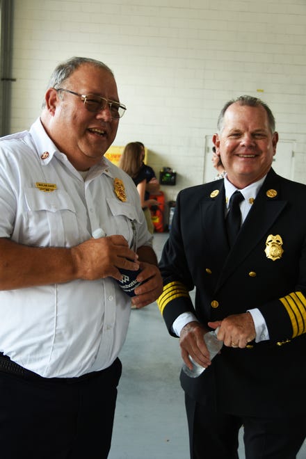 Greater Naples Fire Chief Nolan Sapp, left, with Marco Fire Rescue Chief Chris Byrne after the groundbreaking. The city broke ground on their new fire station Tuesday morning, inside the old station which will be razed to make room for it.