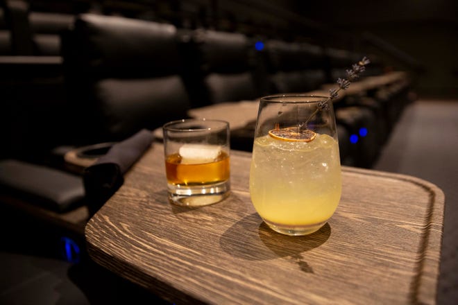 The Smoked Bourbon, with Old Forester, vanilla syrup, served over a hickory-smoked king cube,  left, and a Lavender Lemon Spritz, with SKYY Vodka, lavender-lemon syrup, pineapple juice, and Prosecco, right, photographed, during the CMX CinéBistro Coastland (Naples) VIP Day, Tuesday, Sept. 28, 2021, at the Coastland Center in Naples, Fla.

CMX CinéBistro is an upscale dining and movie experience and its grand opening is on Oct. 1.