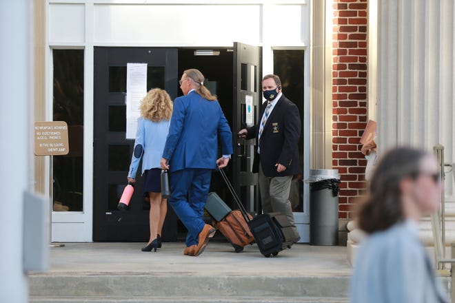 The attorneys for Greg McMichael enter the Glynn County Courthouse on Monday October 18, 2021.