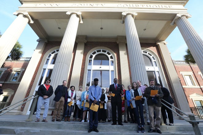 Worship leaders from all around Glynn County offer prayer and song on the steps of the Glynn County Courthouse Monday morning as pre-trial motions are heard in the trial of the 3 men accused of killing Ahmaud Arbery.