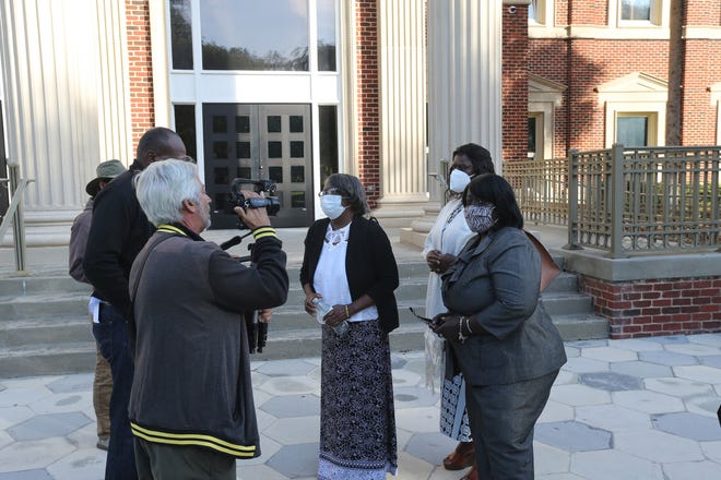 Ahmaud Arbery's aunts Diane Arbery Jackson, Kimberly Cummings Arbery, and Ruby Arbery speak to the media Monday outside the Glynn County Courthouse.